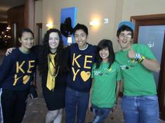 students posing with one giving a thumbs up